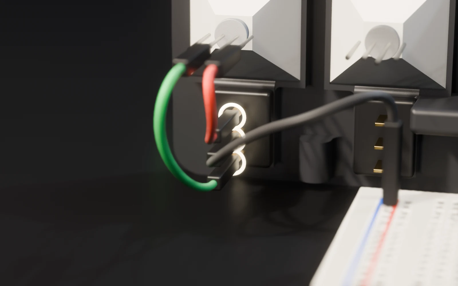 The switch from behind: three pins marked, ground in the middle, red on top, green below